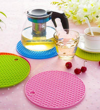 Silicone hot mat featuring a simple design for use under hot pots and pans.