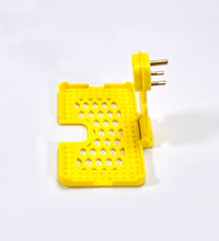 Wall-mounted mobile charging holder in yellow.