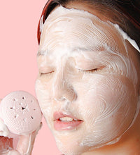 Silicone face scrubber in cute octopus shape, ideal for facial cleansing.