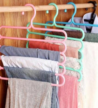 5-layer multipurpose plastic hanger in use with clothes