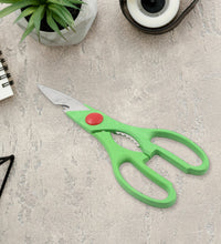 Full view of kitchen scissors showing its versatility for food preparation and bottle opening.