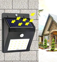 Black solar security LED light for outdoor use.