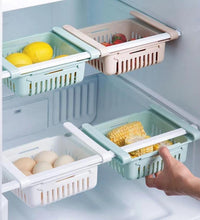 Adjustable fridge organizer drawers for storage.