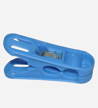 Multicolored plastic clips with strong grip for cloth drying.