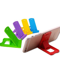 Foldable stand for mobile devices, compact and easy to carry.