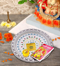 Close-up of silver plated pooja thali.