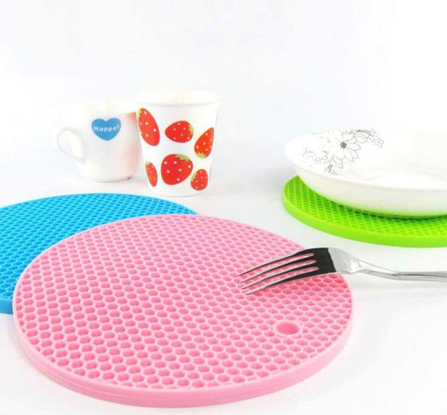 Silicone hot mat designed to protect surfaces from hot cookware with a flexible material.