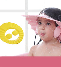 Adjustable soft baby shower cap for safe bathing.