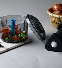 Push chopper with lock feature, ideal for kitchen use