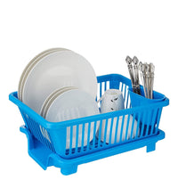 Plastic drying rack with a brown box for holding dishes, utensils, and kitchen items