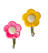 Pack of 5 adhesive flower-shaped hooks for wall decor.