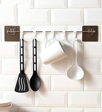 Multipurpose self-adhesive hooks, plastic, suitable for home use.