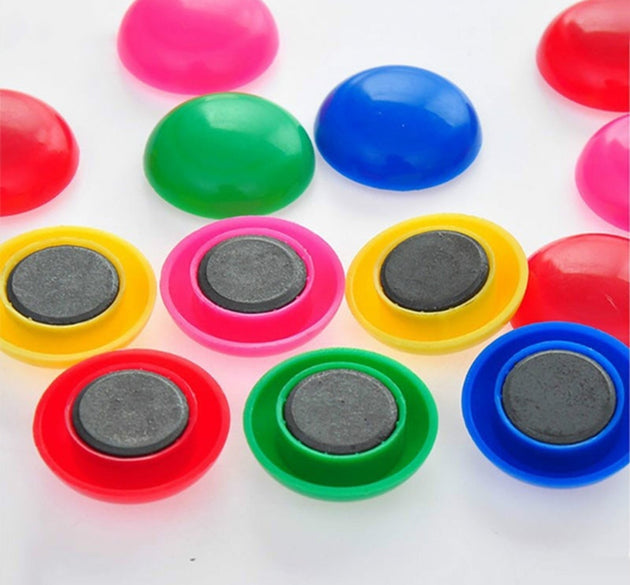 Circular plastic magnets, close-up.