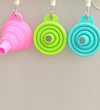 Foldable silicone funnel for kitchen use.