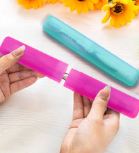 Set of four portable toothbrush cases.