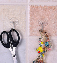 Small strong adhesive wall hooks in stainless steel for versatile use