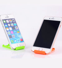 Universal phone holder stand that is portable and foldable.