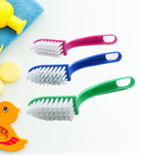 Set of three multi-purpose kitchen cleaning brushes for fish and vegetables.