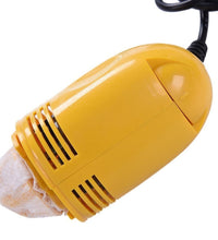 Handy mini vacuum cleaner for quick dust removal from electronic devices.