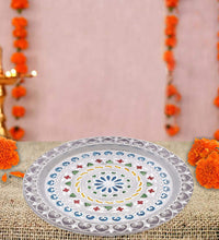 Detailed view of silver plated pooja thali.