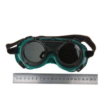 Large dark green welding goggles for safety.