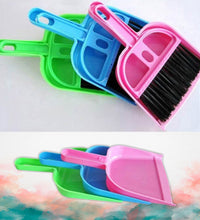 Lightweight dustpan with small broom for easy cleaning.