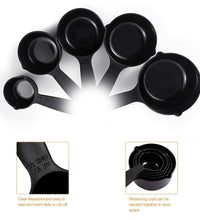 Black plastic measuring cups and spoons arranged with a butterfly-shaped holder for convenience