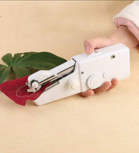 Portable sewing machine with thread and fabric