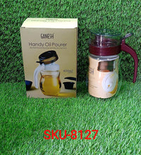 Small nozzle stainless steel oil container.