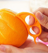 Ring-shaped peeler, snail design for oranges.