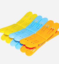 Double pin plastic clips in multicolour for strong cloth holding.