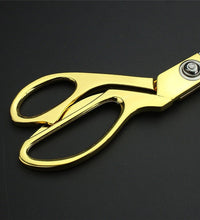 Durable cloth cutting scissors with gold-plated finish.