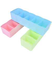 Compact 5-compartment storage organizer for socks and undergarments.