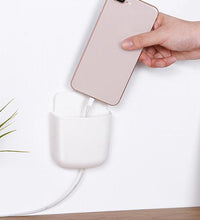 Phone holder with charging port.