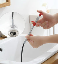 Sturdy metal wire brush with a hook for easy cleaning of kitchen sinks and clogged drains.