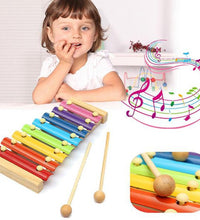 Colorful wooden xylophone with multicolored bars and mallet