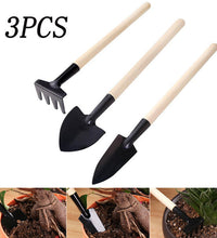 Kid's garden tool set with trowel, shovel, and rake