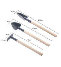 Set of kid's garden tools: trowel, shovel, rake