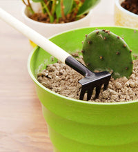 Kid's gardening set with trowel, shovel, and rake