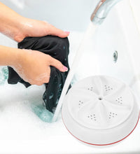 Portable mini washing machine with lightweight design, USB cable, ideal for various settings.