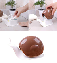 Portable liquid soap dispenser in a snail shape for easy use.