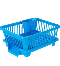 Plastic dish drainer rack with a brown box for drying dishes and utensils