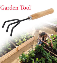 Black steel hand cultivator for gardening tasks.