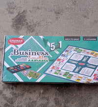 Plastic money coins and game board with game pieces for business game