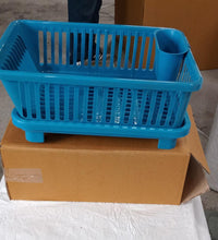 Dish drainer rack in a brown box, showing the plastic design for efficient drying