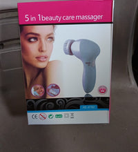 Pink 5-in-1 facial and body massager.