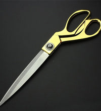 Premium cloth cutting scissors with gold finish.