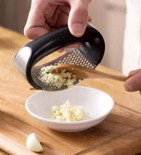 Garlic press on table