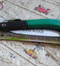 Folding saw for tree trimming and various cutting tasks, ideal for camping and gardening.