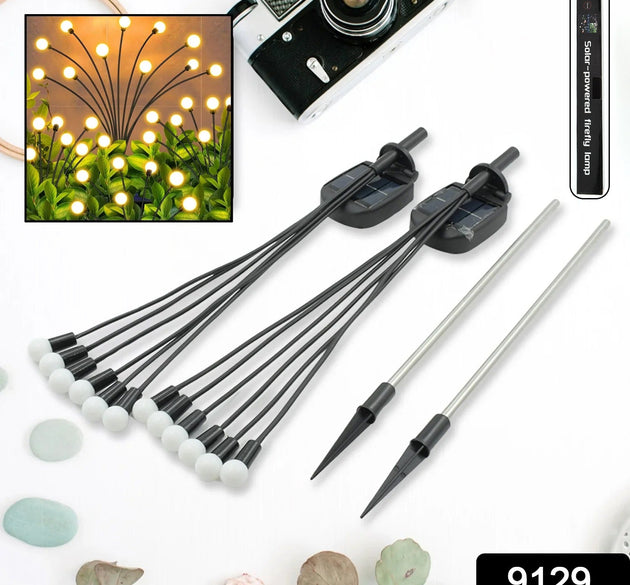 Solar garden lights with firefly design, warm light